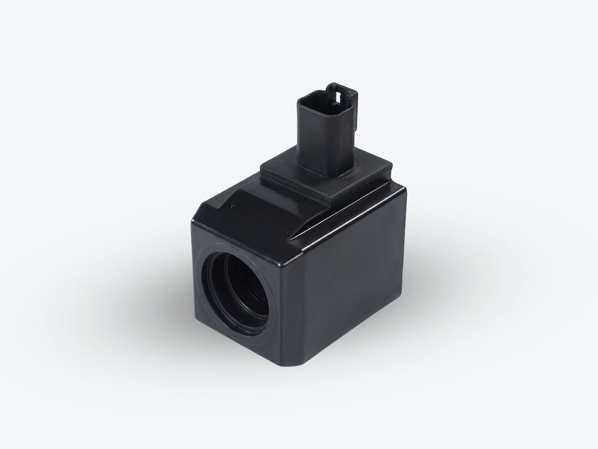 An image showing a side view of COIL 12V (Part 25/221054)